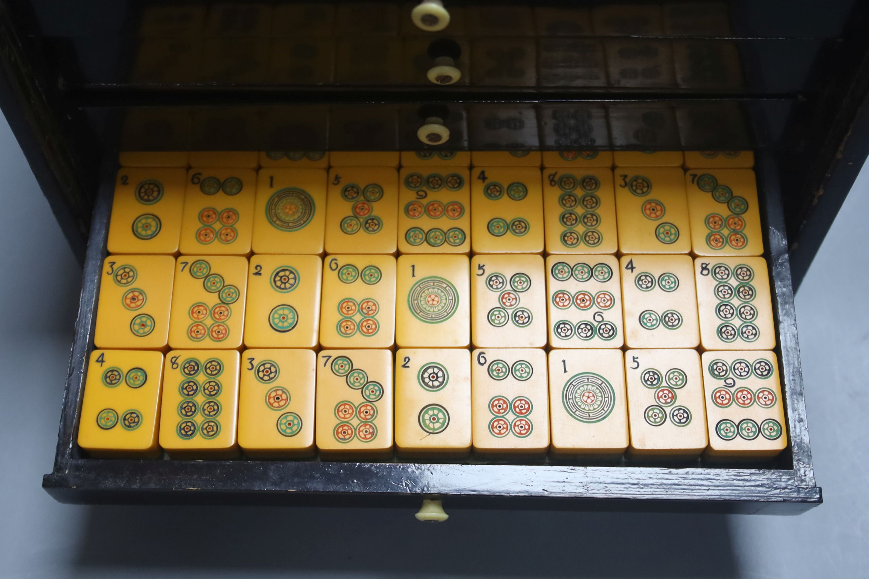 A Chinese lacquer cased Mah Jong set